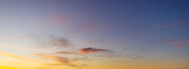 Beautiful golden sunset sky with wispy cirrus clouds at twilight,A breathtaking view of the evening...