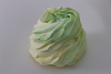 Obraz premium Meringue on a white background, close-up, macro