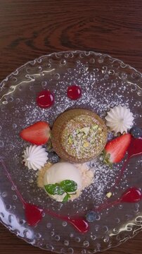 Delicious Chocolate Lava Cake souffle with Powdered Sugar and ice cream kitchen preparation High quality FullHD footage