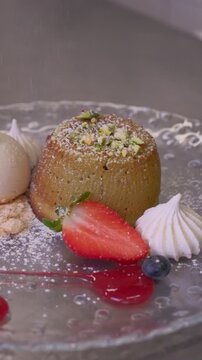 Delicious Chocolate Lava Cake souffle with Powdered Sugar and ice cream kitchen preparation High quality FullHD footage