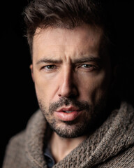 Serious caucasian man looking forward with intense facial expression