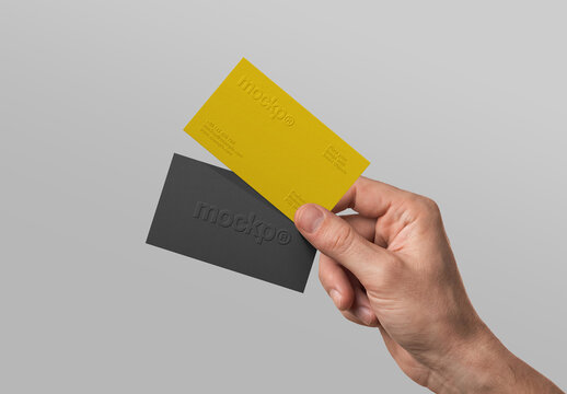 Business Card Mockup - Hand Holding Embossed Cards