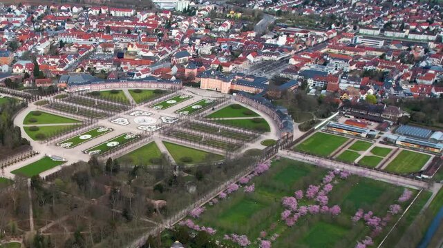 An panoramic aerial view beside the old town an palace of the city Schwetzingen in Germany on a sunny early spring morning during the cherry blossom season.