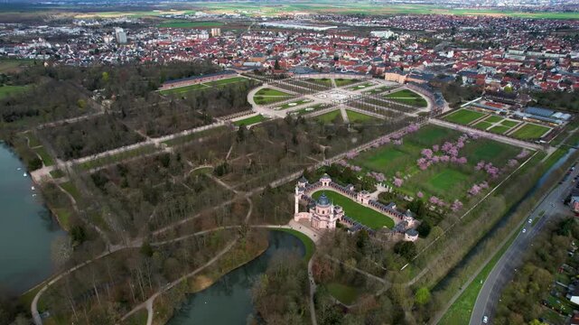 An panoramic aerial view beside the old town an palace of the city Schwetzingen in Germany on a sunny early spring morning during the cherry blossom season.