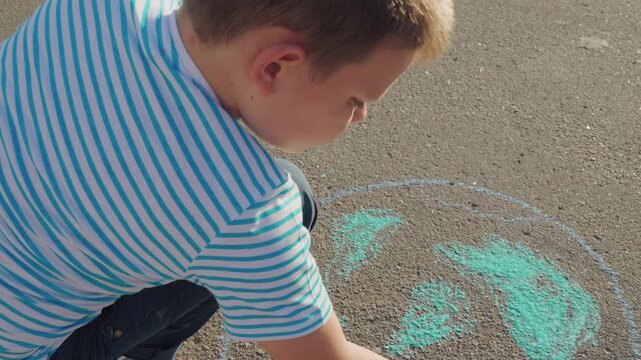 Clean planet Earth, boy child draws chalk asphalt, Kid child baby boy, Earth through chalk hands, child s global touch, nurturing love for planet, youthful inspiration outdoors, sidewalk worldview
