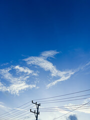 Fototapeta premium Telephone Pole Against Blue Sky