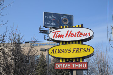 Obraz premium retro style pylon sign at entrance to Tim Hortons, a coffee shop chain, located here at 1900 O'Connor Dr, North York, Toronto