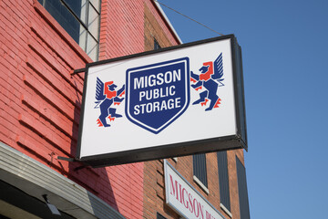 Obraz premium wall mounted projecting sign outside Migson Public Storage located at 2356 Gerrard St E, Toronto