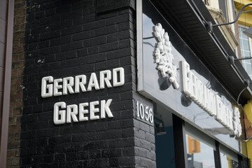 Obraz premium exterior building facade and sign of Gerrard Greek, a restaurant, located at 1056 Gerrard St E, Toronto