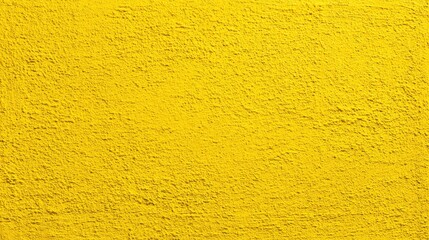 A vividly colored yellow wall showcases a textured surface, offering an eye-catching backdrop for artistic creations and interior design ideas in urban settings.
