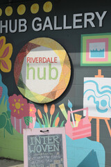 Naklejka premium eclectic exterior wall of entrance to Riverdale Hub, a non-profit organization, located at 1326 Gerrard St E, Toronto