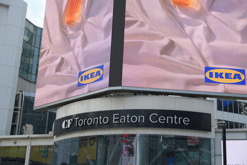 Naklejka premium part of digital advertisement for IKEA over entrance to CF Toronto Eaton Centre, Sankofa Square
