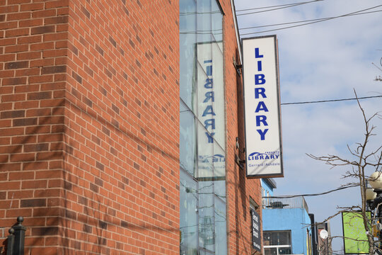 wall mounted projecting sign on the exterior of Toronto Public Library - Gerrard/Ashdale Branch, 1432 Gerrard St E