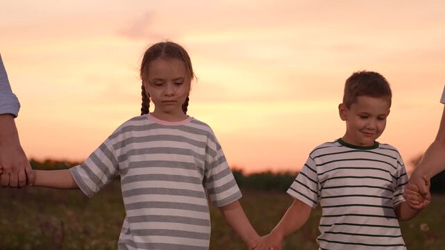 mother father children boy girl park sunset, man woman toddlers outdoors, Sure Here are 10 options for image titles in English, separated by commas: