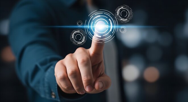 Hand pressing virtual holographic syncing button in dark futuristic environment