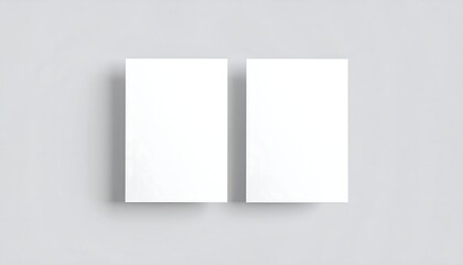 Fototapeta premium Two Blank Business Cards on a Light Gray Background.