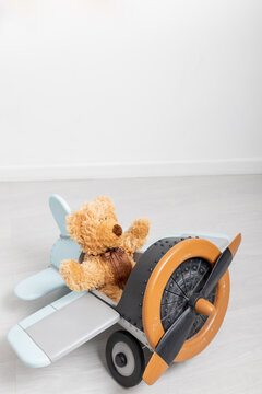 teddy bear and wooden toy airplane with world map, Travel concept. party decoration.children's toys happy birthday day. copy space. Commitment and creative growth concept