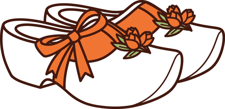 Dutch wooden clogs with orange ribbons and blooming flowers