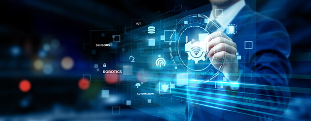 Fototapeta premium Businessman pointing at Industry 4.0 technology on futuristic digital interface screen, smart factory automation, IoT integration, advanced manufacturing, industrial innovation concept