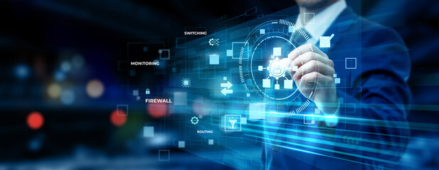 Businessman pointing at network administration technology on futuristic digital interface screen,...