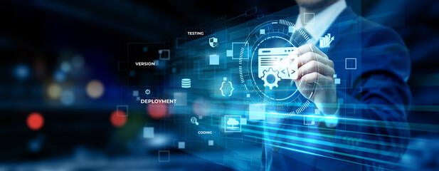 Fototapeta premium Businessman pointing at software development technology on futuristic digital interface screen, coding platform, application design system, IT solution innovation concept