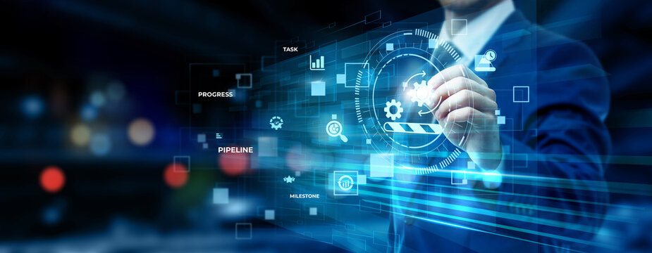 Businessman pointing at work in progress technology on futuristic digital interface screen, project tracking system, task management dashboard, workflow monitoring concept