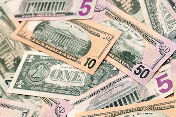 United States dollars money bills pile on table. USA banknotes of USD currency close up.