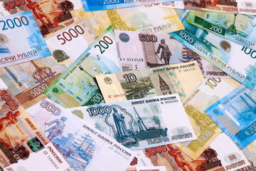 Russian ruble money bills pile on table. Russia banknotes of RUB currency close up.