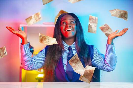 A professional African woman celebrates ecstatically as Rand banknotes fall around her. The striking neon lighting emphasizes a theme of wealth, victory, and South African economic success.