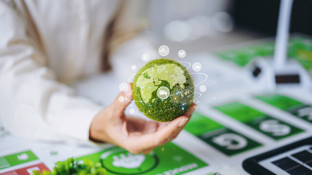 Green globe with environmental icons representing net zero carbon strategy, renewable energy transformation and sustainable ESG business development concept