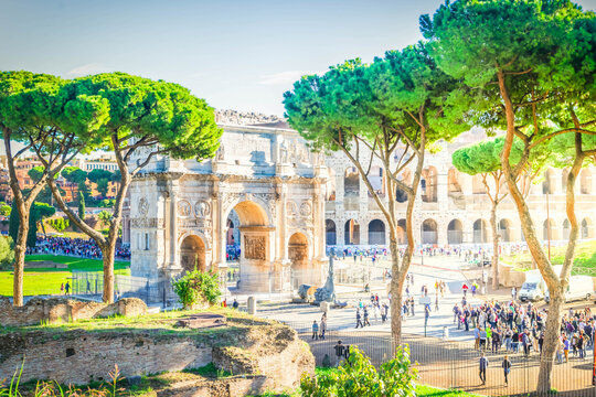 Arch of Constantine and Colosseum at summer day, antique Rome city, Italy