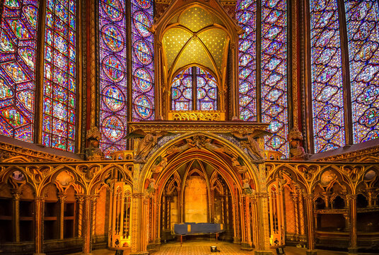 Stained glass windows of Saint Chapelle with rose window, medieval church of 13c., Paris France