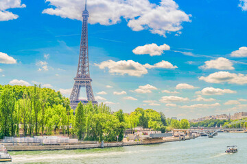 Obraz premium Eiffel Tower and Seine riverbank at summer day, Paris, France