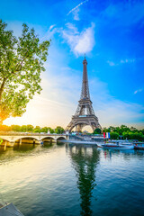 Obraz premium Paris Eiffel Tower and river Seine with sunrise in Paris, France. Eiffel Tower is one of the most iconic landmarks of Paris, web banner format ar early morning