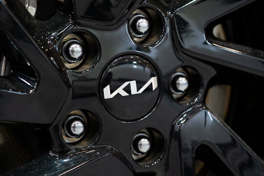 Close up of Kia logo on black alloy wheel hub. Toronto, Canada - February 19, 2026.