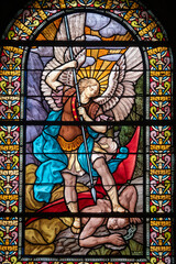 Stained glass (1916) of Saint Michel the Archangel killing a demon.