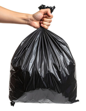 A clean hand firmly grips the gathered top of a large, full black garbage bag ready for disposal or recycling collection&nbsp;