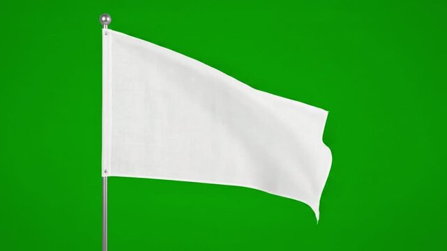 Blank white surrender flag waving gently on flagpole against bright green screen background motion footage