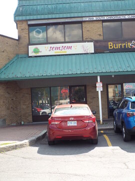 Ottawa, Ontario, Canada-July 16, 2025: The "semsem" restaurant storefront at 2430 Bank Street.