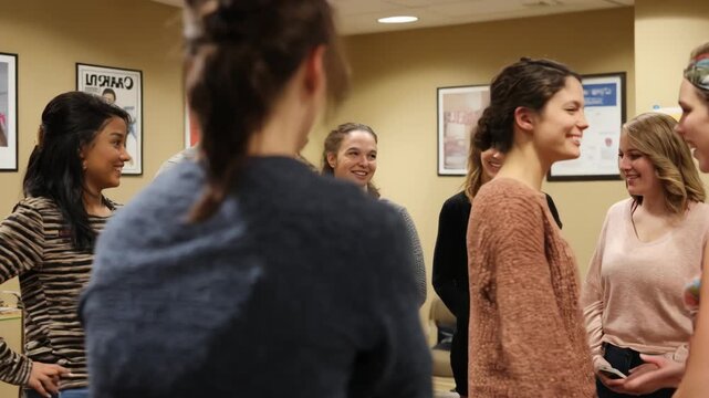 Medium shot of a group practicing roleplay exercises in an inperson debt collection class emphasizing interpersonal skills and effective communication techniques.