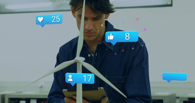 Engineer tapping tablet and adjusting turbine blades in engineering lab, animated bubbles rising