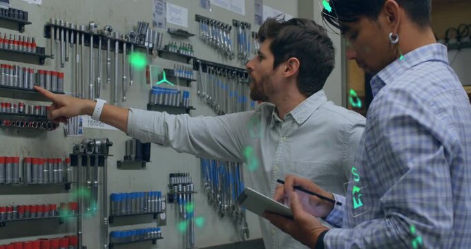 Tablet input initiating workshop check, man reaching pegboard while tech logging AR icons drifting