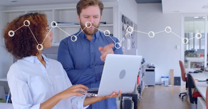 Woman holding laptop and pointing, starting animated dotted nodes as team reviewing business data