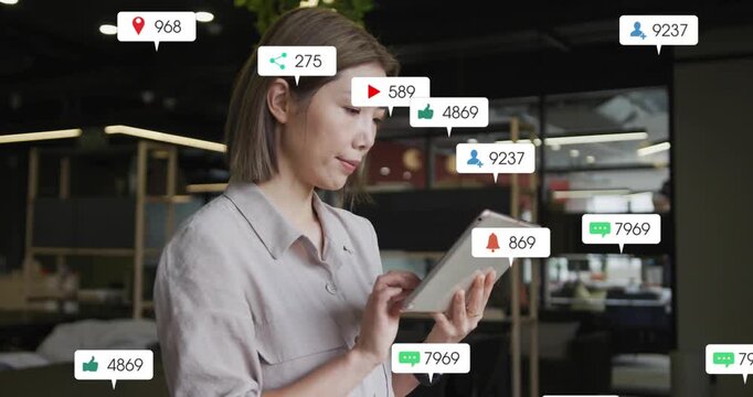 Office woman tapping tablet, starting alerts filling around her while tracking marketing metrics