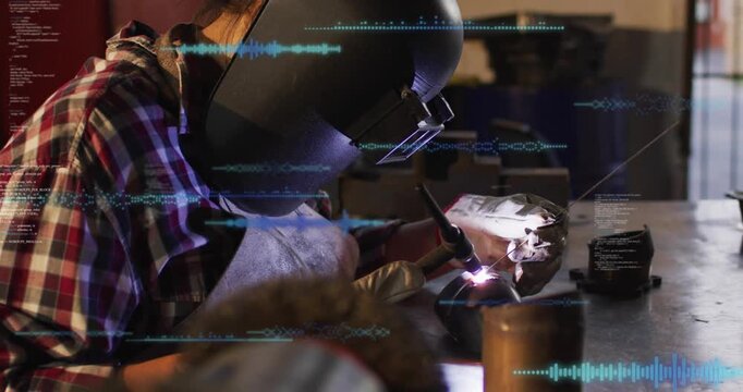 Woman welder guiding torch engaging arc and sparking blue wave data growing over part for metalwork