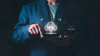 Concept of digital transformation, big data management, information technology services, and remote hosting solutions, Businessman using a tablet to access cloud storage and data server network © 418 House