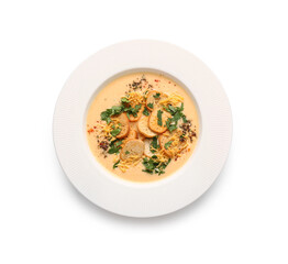 Bowl of tasty cheese soup with parsley and croutons on white background