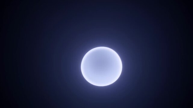 Bright full moon glowing softly in a deep blue night sky.