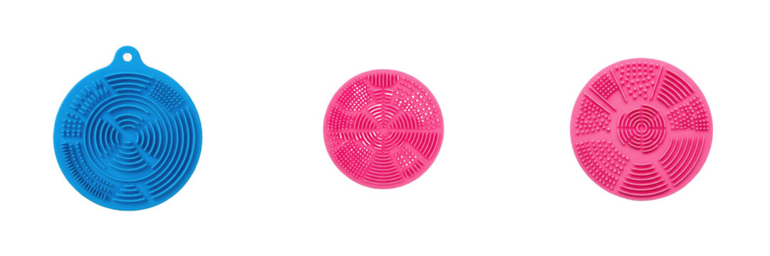 Brush cleaner pad isolated on white background, silicone cosmetic brush cleaning mat for washing and maintaining makeup brushes, professional beauty tool for hygiene and brush longevity, no shadow