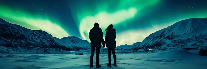 Stunning Northern Lights Display Over Snowy Landscape at Night © Jeerawat